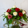 This unique design includes red roses with gold tinted edges, white roses