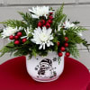 White Flowers, Red Berries, and Mixed Winter Greens 
Arrive in a Mr.