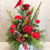 Christmas is a time for celebrating family. This beautiful cardinal arrangement reminds