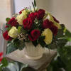 A large lush arrangement of gorgeous red and white premium roses in
