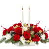 Centerpiece arrangement with candles in white, red and gold colors.