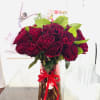 Red Roses in beautiful vase.
A radiant arrangement of red roses graces a