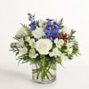 All-around arrangement with white roses, carnations and Peruvian lilies (alstroemeria); blue delphinium;