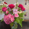Let the designer choose beautiful blooms in a variety of pinks and