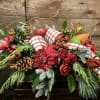 This lush, elongated holiday centerpiece is full of classic Christmas charm. Rich