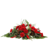 This long and low traditional holiday centerpiece is filled with red and