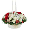 A ribbon adorned while bowl is abundantly arranged with red roses, white