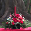 Red roses, red carnations and mini carnations, mixed evergreens, pine cones, ilex