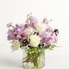All-around arrangement with white roses and carnations; lavender Peruvian lilies (alstroemeria) and
