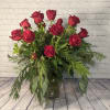 Lush pine, flat cedar, beautiful holly, and a dozen striking red roses