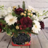 This festive holiday bouquet leans into the spirit of Christmas. From the