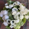 Send the gift of a serene neutral arrangement filled with on ly