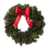 Seasonal Christmas wreath arranged with fillers and a decorative ribbon. 