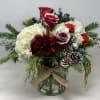 Seasonal floral arrangement for the Christmas season.