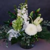 An assortment of beautiful winter white blooms with a touch of festive