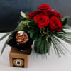 A festive Christmas floral arrangement paired with a single, beautifully crafted gourmet