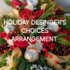 Celebrate this holiday season with an artfully created floral arrangement. 