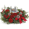 Celebrate the season with this delightful Thomas Kinkade collectible, nestled among festive