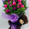 Beautiful tulips wrap with small teddy bear hug