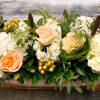 A lush collection of Hydrangea, Roses, Kale and Hypericum with lovely textured