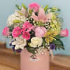 this lovely arrangement captures the harmonious blend of pink hues with touches