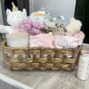 Welcome the newest little baby girl home with a gift basket bursting