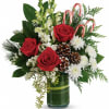 Bursting with Christmas spirit, this lush rose bouquet is accented with candy
