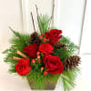 A festive arrangement that brings the spirit of Christmas into full bloom!
