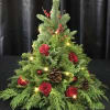 A Christmas tree with red roses