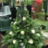 A fresh Christmas tree with white roses