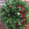 Handmade holiday wreath with the freshest winter greens. Completely customizable with any