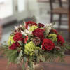 A rich, festive arrangement that feels like the warmth of winter gathered