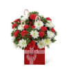 Our CHRISTMAS PACKAGE ARRANGEMENT comes arranged in a bright red ceramic gift