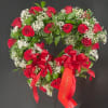 A heart shaped wreath ring covered in Roses of your color choice