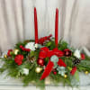 This elegant Christmas centerpiece features two delicate candles that shine with the