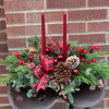 Made entirely of a variety of Christmas greens, berries, festive ribbon and