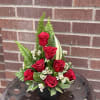 Red Roses in a modern display and classy nuetrals, with a ceramic