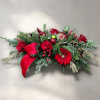 This festive long and low centerpiece style arrangement with it classic design