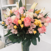 A fresh, uplifting mix of lilies, roses, spray roses and alstroemeria designed