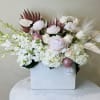 Beautiful mixture of all white and blush flowers including Peonies, Orchids, Anthurium