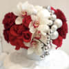 Festive arrangement with gorgeous roses and Orchids in beautiful ceramic vase