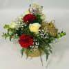 Keepsake gold Christmas bulb container with lid is adorned with white roses