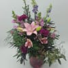 Select this arrangement of snapdragons, carnations, asiatic lilies and larkspur in a