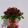 A classic and elegant arrangement featuring premium red roses, fresh greenery, and