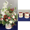 A festive arrangement with classic Christmas greenery and berries, all in a