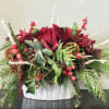 This holiday season we are introducing snow to our arrangements. Flowers, holiday