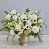This arrangment shows off white florals in all shapes and sizes in