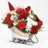 Send holiday cheer in the form of a festive holiday arrangement with