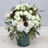 This beautiful arrangement includes our favorite hydrangeas, orchids, and fragrant greens. 
