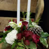 A centerpiece with candles in a Crystal Glass Candy Dish. With Carnations